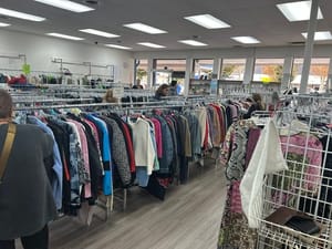 Shoppers browse rows of second-hand clothing on racks inside the Delta Hospital Auxiliary Thrift Shop in Ladner Village.