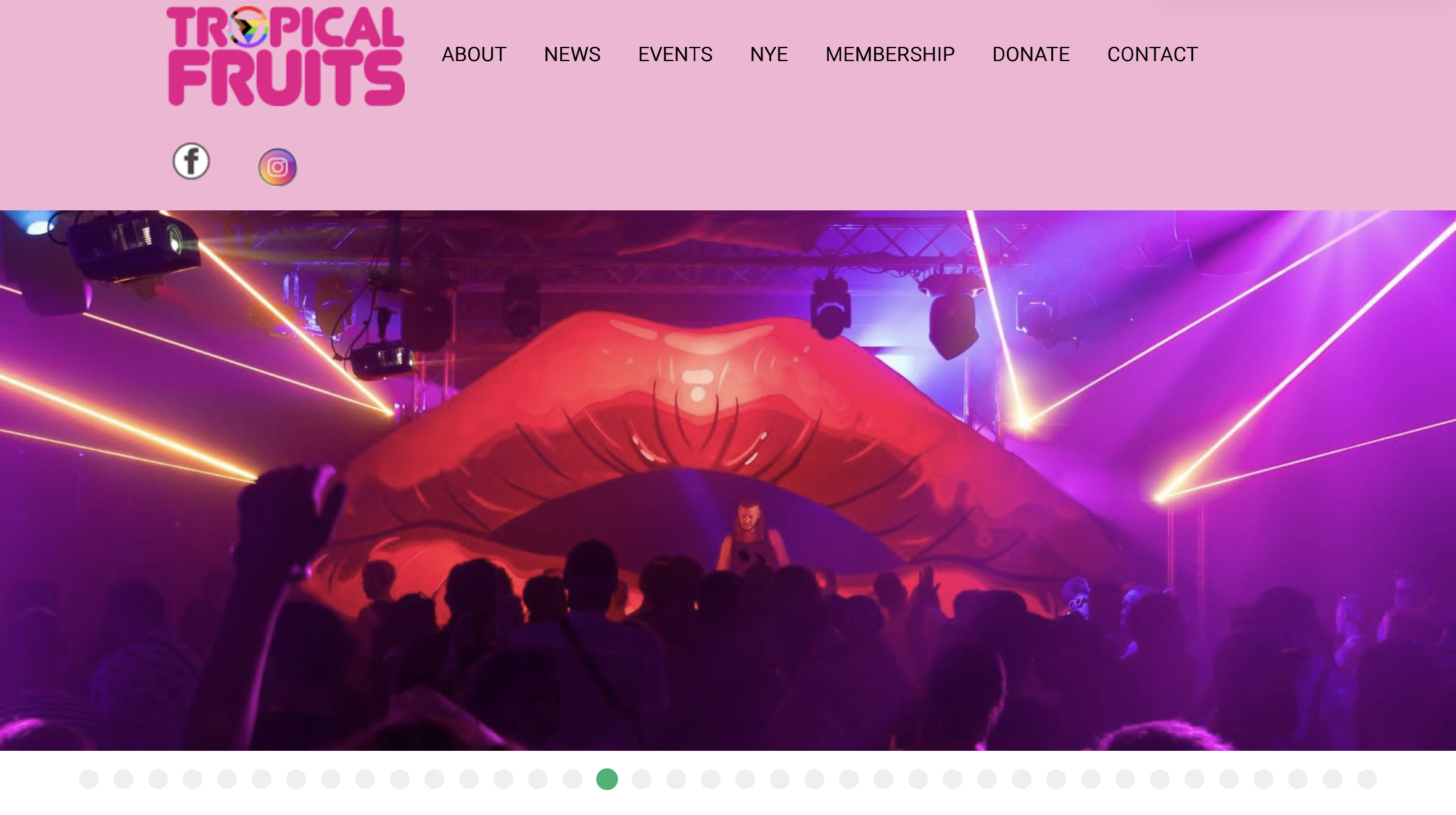 Homepage for Tropical Fruits, with an image of a DJ standing between a pair of giant lips.