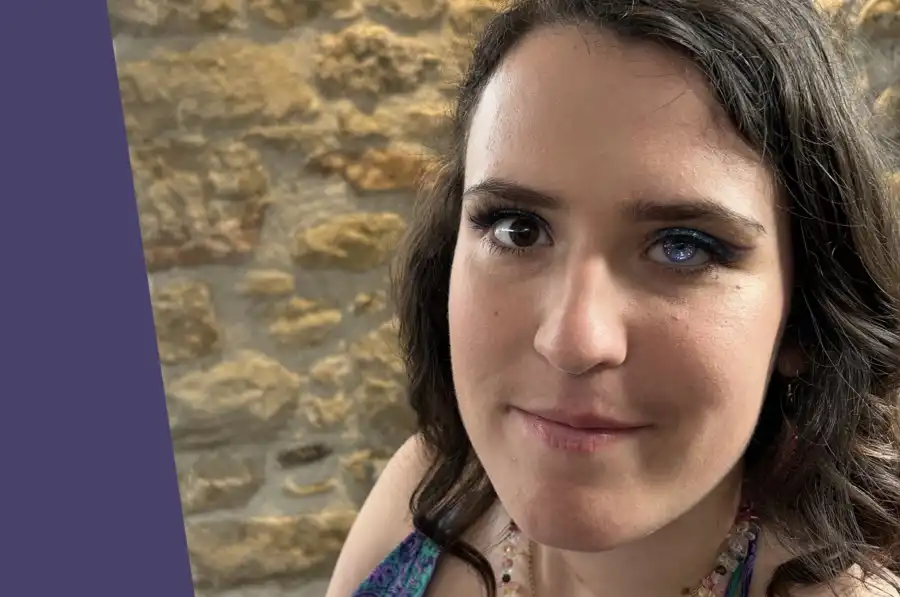 Photo of a light skinned woman with shoulder length brown hair.