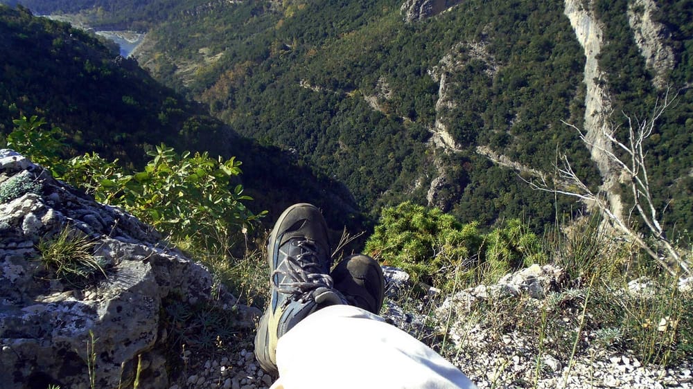 rest at the top of a climb overlooking trail and valley below
