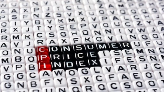 Letter tiles spelling CONSUMER PRICE INDEX with red and black highlights.